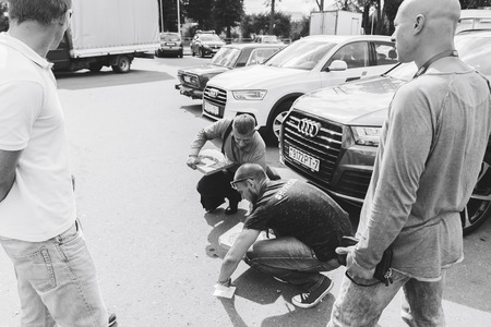 MINSK, BELARUS.August 26, 2017. Test drive audi. A group of people talking on the streetのeditorial素材