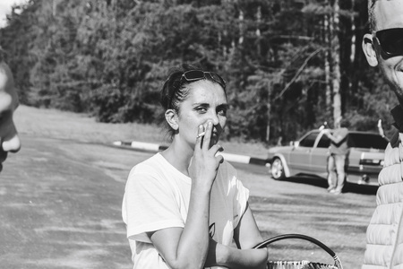 MINSK, BELARUS.August 26, 2017 Test drive audi A woman smokes in the streetのeditorial素材