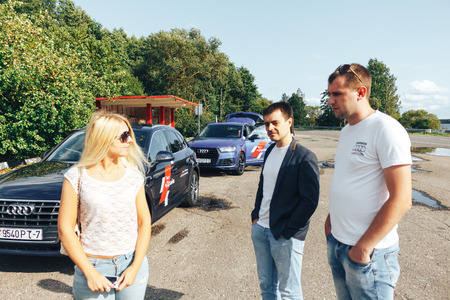 MINSK, BELARUS.August 26, 2017. Test drive audi. A group of people talking on the streetのeditorial素材