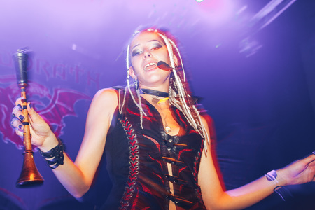 MINSK, BELARUS.September 1 , 2017 Rock band performs in a nightclub The girl shows the performance on stageのeditorial素材