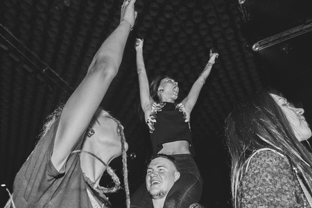MINSK, BELARUS.September 1 , 2017 Rock band performs in a nightclub A group of people watching a...