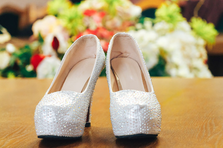 Women's shoes on the background of flowersの写真素材