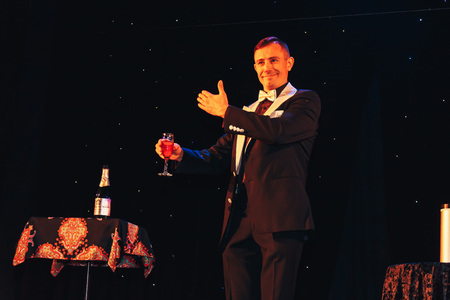 MINSK, BELARUS November 4 2017 International Illusion Festival MAGIC 2017 A male magician shows a presentation with a bottleのeditorial素材