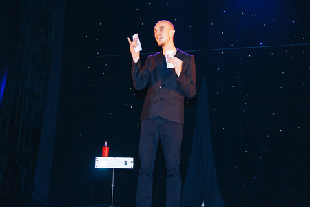 MINSK, BELARUS November 4 2017 International Illusion Festival MAGIC 2017 A male magician shows a presentation with moneyのeditorial素材