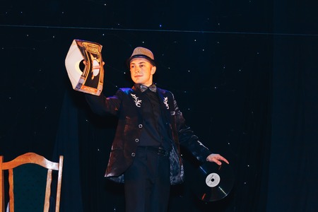 MINSK, BELARUS November 4 2017 International Illusion Festival MAGIC 2017 Young magician shows a performance with a big plateのeditorial素材