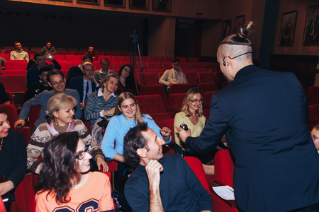 MINSK, BELARUS November 4 2017 International Illusion Festival MAGIC 2017 A young magician takes an assistant girlのeditorial素材