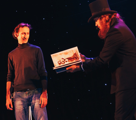 MINSK, BELARUS November 4 2017 International Illusion Festival MAGIC 2017 Male magician and assistant shows stage performanceのeditorial素材