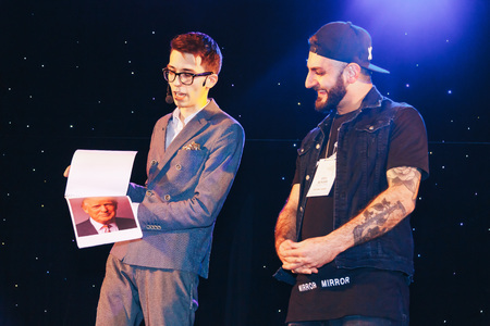 MINSK, BELARUS November 4 2017 International Illusion Festival MAGIC 2017 A young magician with an assistant shows the performance on stageのeditorial素材