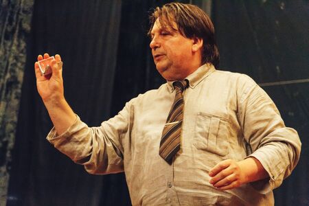 MINSK, BELARUS November 4 2017 International Illusion Festival MAGIC 2017 Seminar Man shows tricks with cards standing on stageのeditorial素材