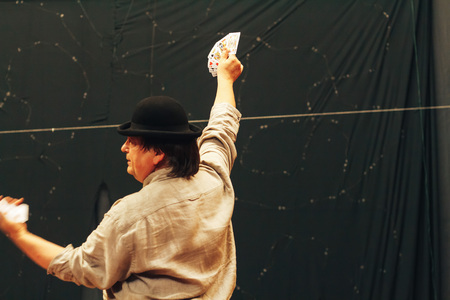 MINSK, BELARUS November 4 2017 International Illusion Festival MAGIC 2017 Seminar Man shows tricks with cards standing on stageのeditorial素材