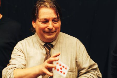MINSK, BELARUS November 4 2017 International Illusion Festival MAGIC 2017 A man shows a group of...