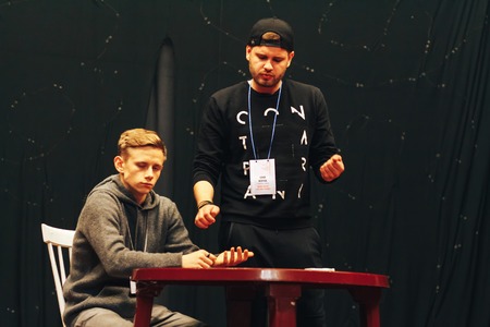 MINSK, BELARUS November 4 2017 International Illusion Festival MAGIC 2017 Seminar The man shows tricks with a bucket with an assistantのeditorial素材