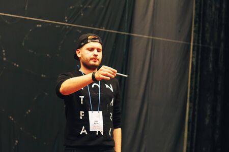 MINSK, BELARUS November 4 2017 International Illusion Festival MAGIC 2017 Seminar The guy shows how to do magic tricks with a cigaretteのeditorial素材