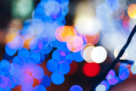 New year garlands near the road Blurred background
