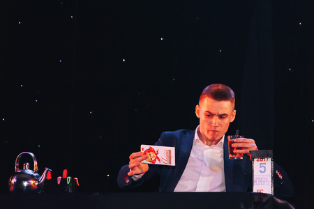 MINSK, BELARUS November 4 2017 International Illusion Festival MAGIC 2017 A young magician shows the performance on stageのeditorial素材