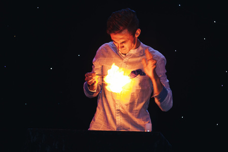 MINSK, BELARUS November 4 2017 International Illusion Festival MAGIC 2017 A young magician shows the performance on stageのeditorial素材