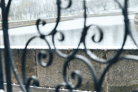 Forged fence fence on the river bankの写真素材