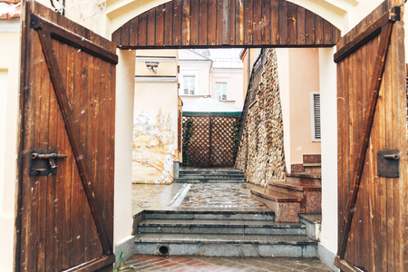 Old town street in late fall It's wet snowの写真素材