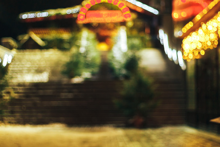Entrance to the bar decorated with fir-trees blurred viewの写真素材