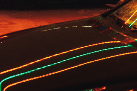 The black car is standing on the streetの写真素材