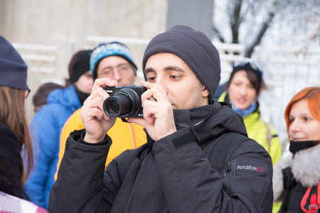 Minsk, Belarus, December 10, 2017 Volunteer's Day A man with a camera is standing outdoorのeditorial素材