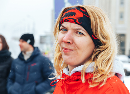 Minsk, Belarus. March 8, 2018 Women's Race Public action Women against violence The girl is running...