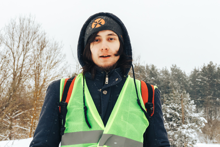 Minsk Belarus .4 March 2018 Zhuk-treil 4Minskoe Sea The guy in the signal jacket is standing outdoorsのeditorial素材