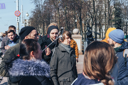 Minsk, Belarus. March 25, 2018 A holiday dedicated to the 100th anniversary of the founding of the Belarusian People's Republic A group of people stand with mobile phones outdoorsのeditorial素材