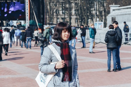 Minsk, Belarus. March 25, 2018 A holiday dedicated to the 100th anniversary of the founding of the Belarusian People's Republic Girl stands outdoorsのeditorial素材