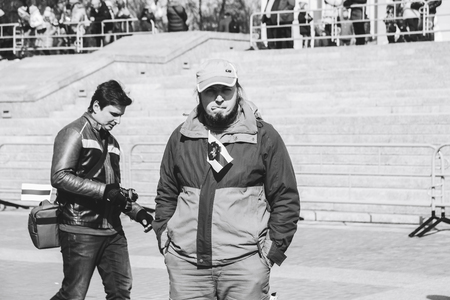 Minsk, Belarus. March 25, 2018 A holiday dedicated to the 100th anniversary of the founding of the Belarusian People's RepublicThe man is standing outdoorsのeditorial素材