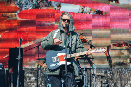 Minsk, Belarus. March 25, 2018 A holiday dedicated to the 100th anniversary of the founding of the Belarusian People's Republic A man with a guitar is standing on stageのeditorial素材