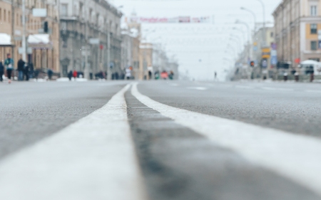 The road with running people in the distance