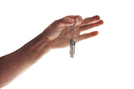 Male hand holding flash drive isolated on white background