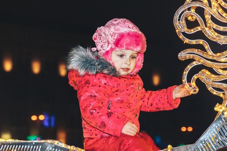 December 30, 2018 Minsk Belarus New Year's celebrations in the town square. Little girl sitting on a glowing horseのeditorial素材