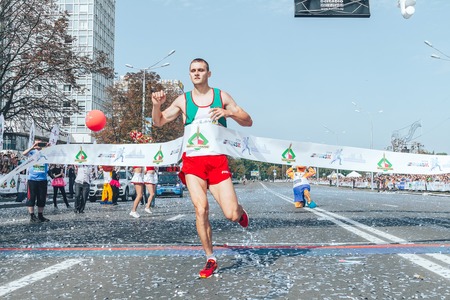 September 9, 2018 Minsk Belarus Half Marathon Minsk 2018 A man runs on the road and finishes firstのeditorial素材