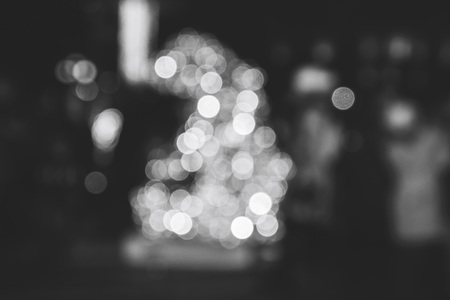Blurred background of colorful lights of a luminous figure of a hare. An image of an abstract blurred bokeh background with warm colored lightsの写真素材