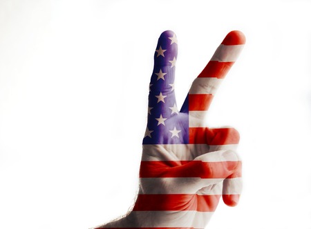 Hand painted in colors of american flag showing sign of liberty. Isolated on white backgroundの写真素材