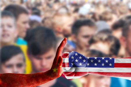 Diplomatic standoff between the United States and China. Concept trade war between usa and china on a background of people in blurの写真素材