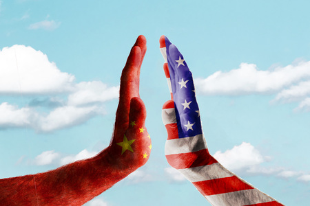 Concept trade war between usa and china against blue skyの写真素材