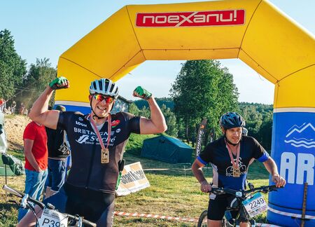May 26-27, 2018 Naliboki,Belarus All-Belarusian amateur marathon Naliboki A man is riding a bicycle...