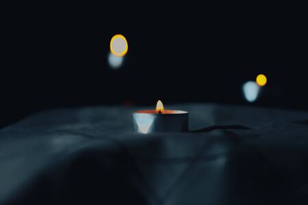 Candles burn in the night in memory of the dead