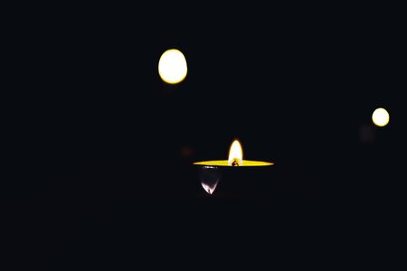 Candles burn in the night in memory of the deadの写真素材