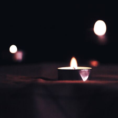 Candles burn in the night in memory of the deadの写真素材