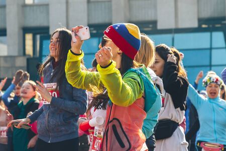 March 8, 2019 Minsk Belarus Women's Day Race on March 8 Young girls and mature woman are standing in front of a race. Close upのeditorial素材