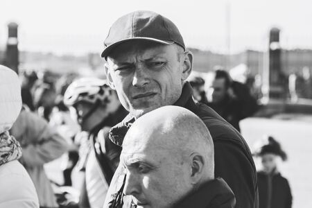 October 6, 2018 Novogrudok Belarus Castle Road Two men stand to register the race. Black and white...
