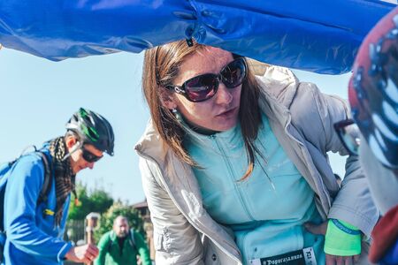 October 6, 2018 Novogrudok Belarus Castle Road Girl athlete looks into the tent to register the race