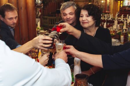 December 1, 2018 Minsk Belarus Wedding Day Ceremony Guests all clink glasses with alcohol Required marriage ritualのeditorial素材