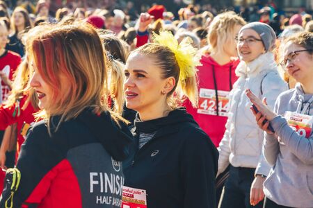 March 8, 2019 Minsk Belarus Women's Day Race on March 8 Beautiful happy girls stand before a race on the street.のeditorial素材