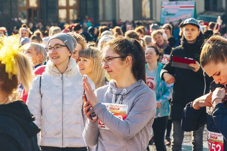 March 8, 2019 Minsk Belarus Women's Day Race on March 8 Beautiful young girls stand on the square before the race Close upのeditorial素材