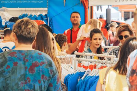 June 23, 2019 Minsk Belarus Street festivities in honor of the Second European Games People buy sports things on the street.のeditorial素材